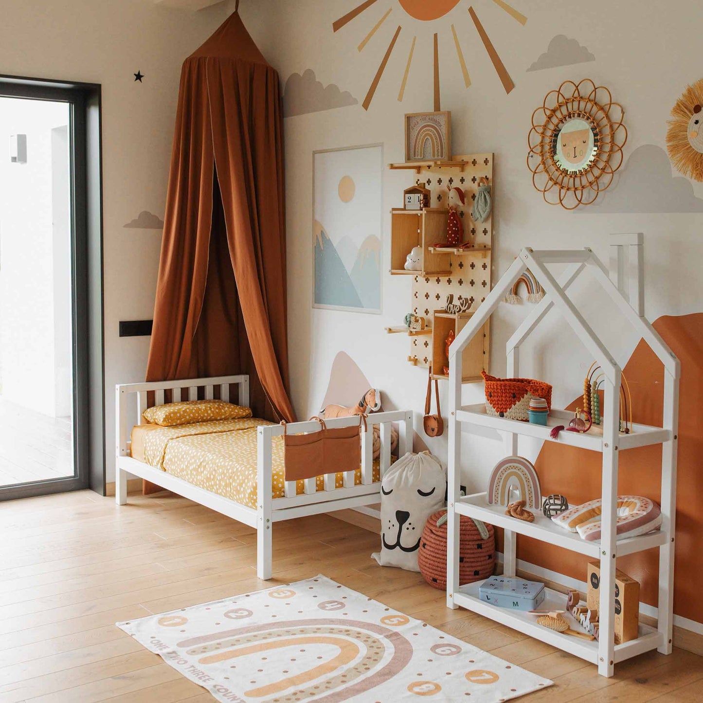 Raised kids' bed on legs with a headboard and footboard