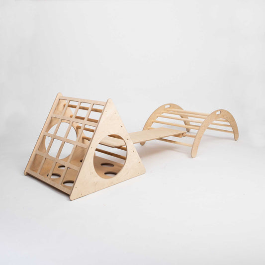 A Sweet Home From Wood wooden play structure with a Climbing triangle + Climbing arch + a ramp in the middle.
