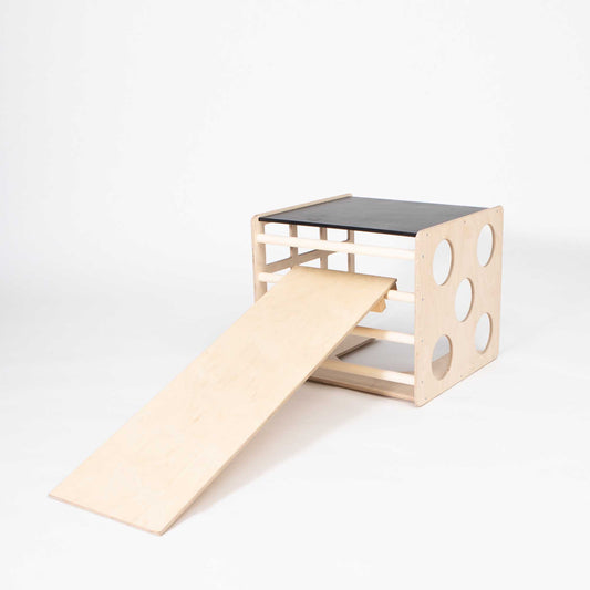 Activity cube with sensory panels and a ramp