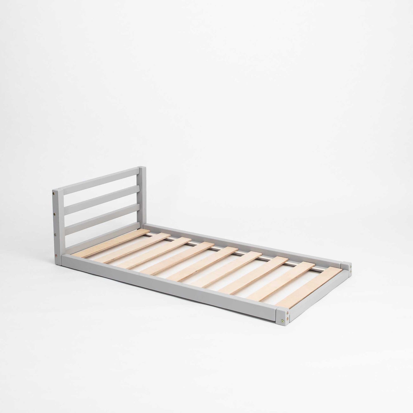 A Sweet Home From Wood Toddler floor bed with a horizontal rail headboard and wooden slats on a white background.