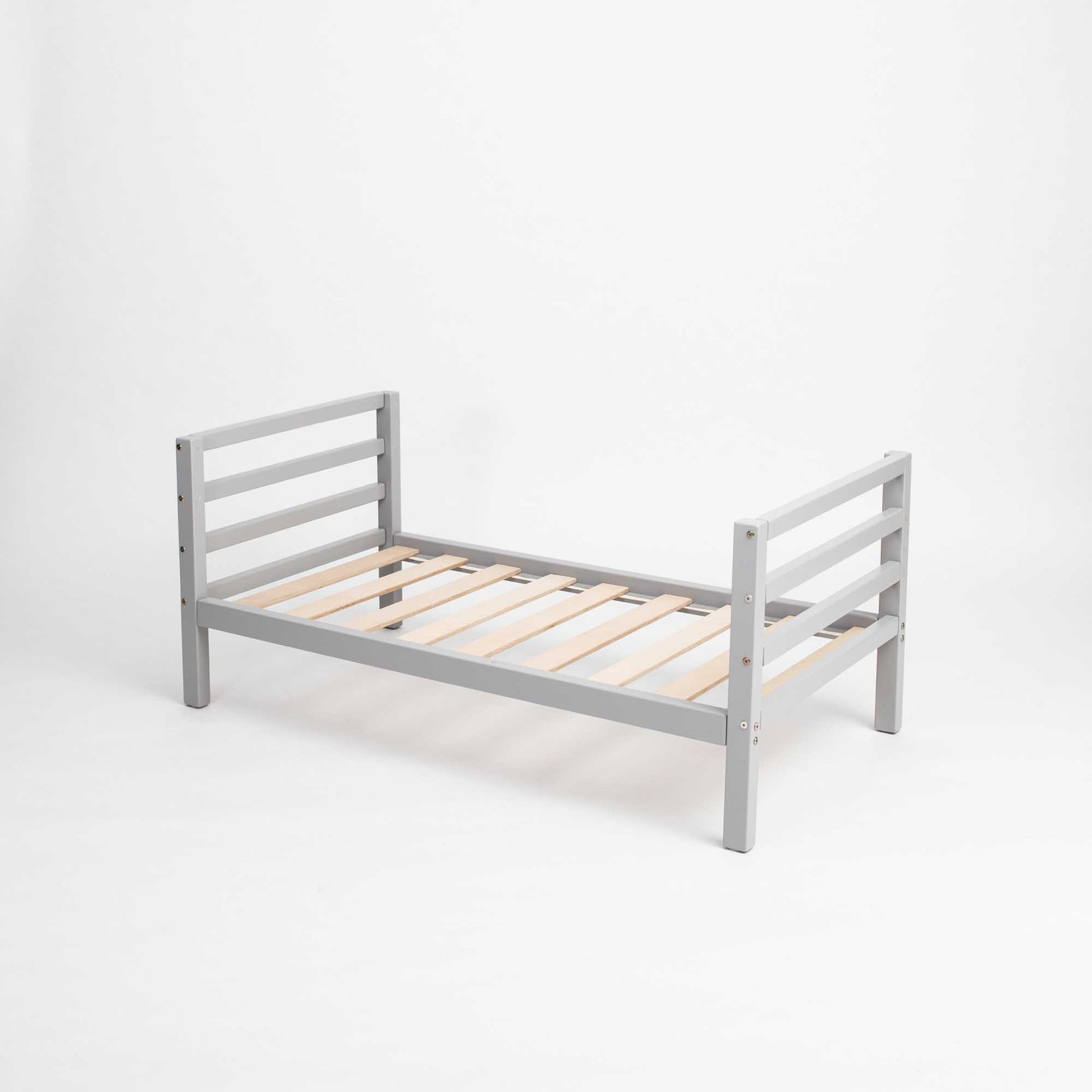 A Sweet Home From Wood kids' bed on legs with a horizontal rail headboard and footboard made of grey wooden slats against a white background.