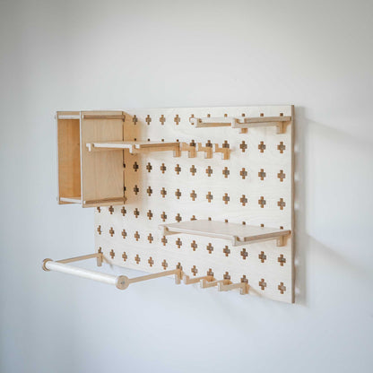 A Sweet HOME from wood Pegboard with Clothes Hanger hanging on a wall.