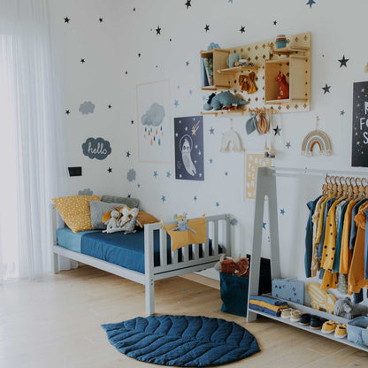 A child's room with open Pegboard Wall Shelf shelves for the toddler, from Sweet HOME.