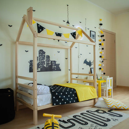 Kids' house bed on legs with a headboard and footboard