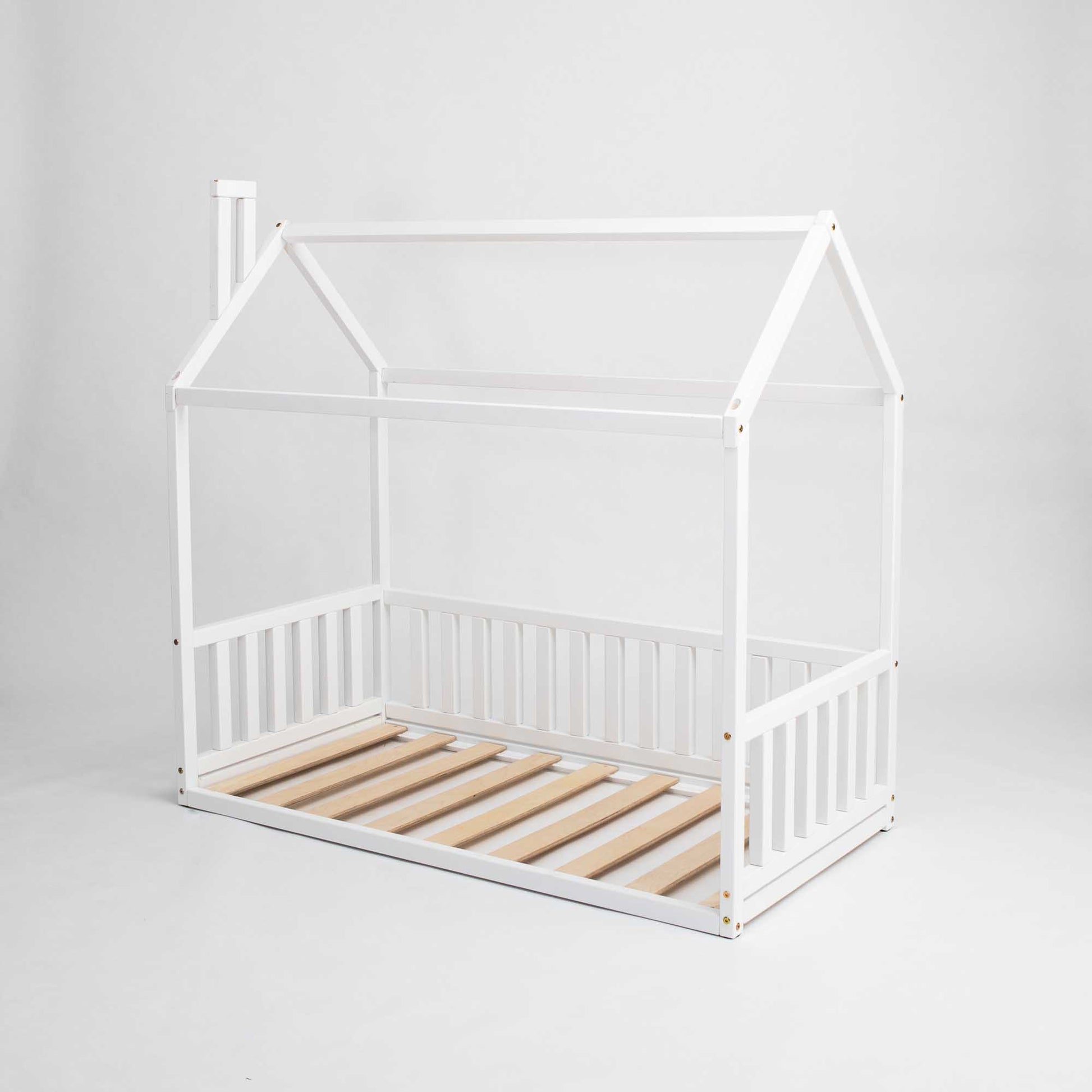 A Sweet Home From Wood Kids' house-frame bed with 3-sided rails in a cozy sleep haven design made of white wooden slats.