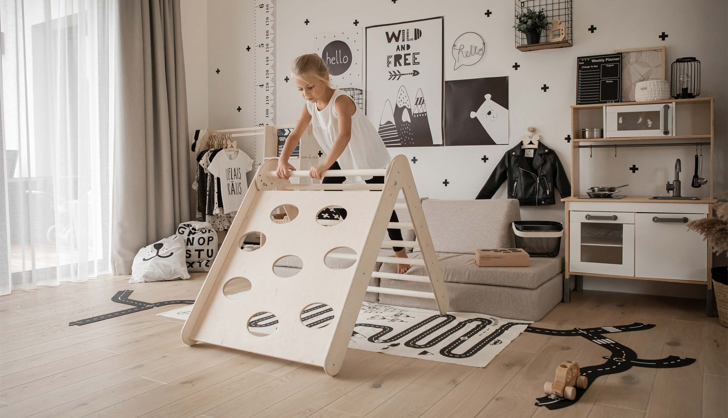 A child's room with a wooden play structure.