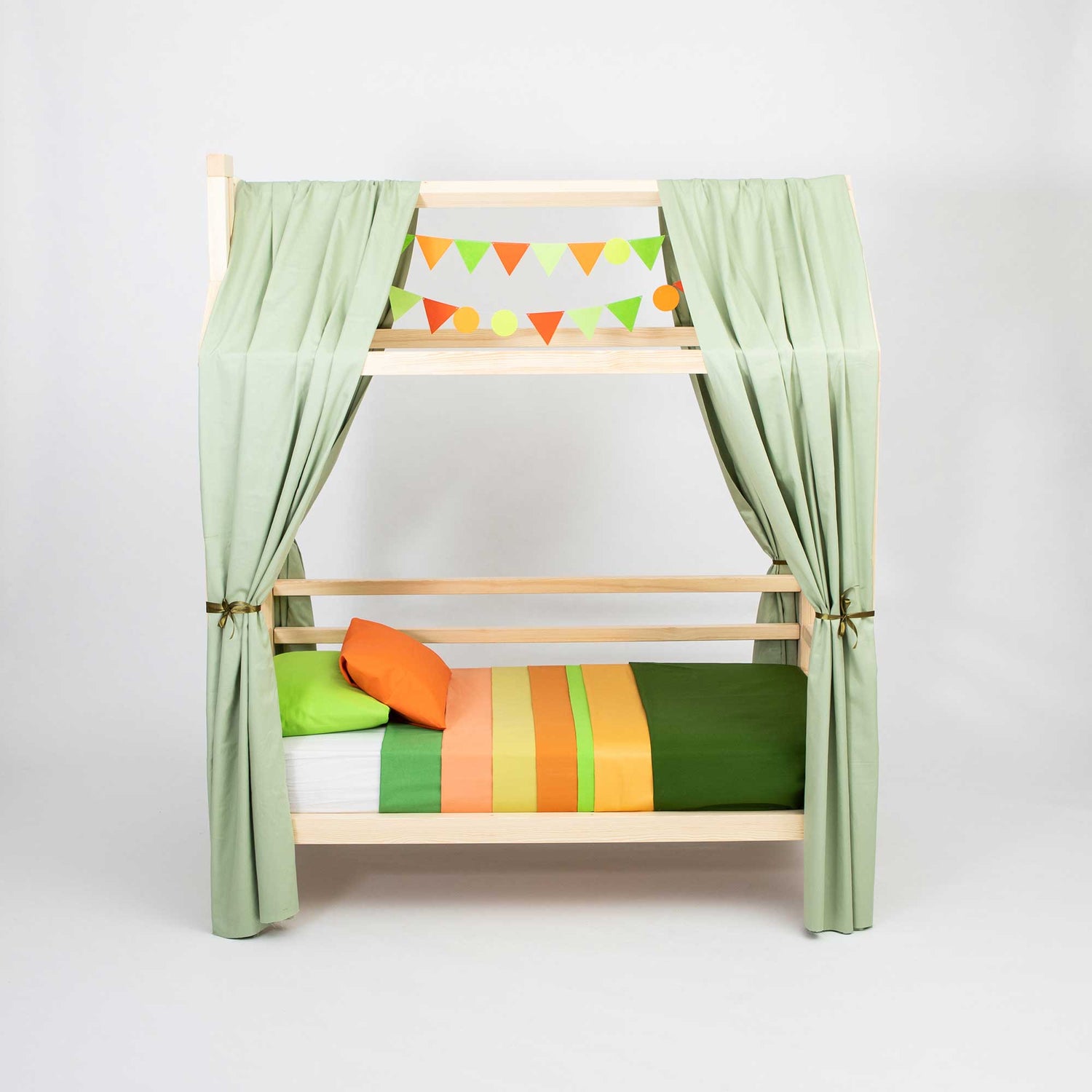 A green bunk bed with colorful curtains.