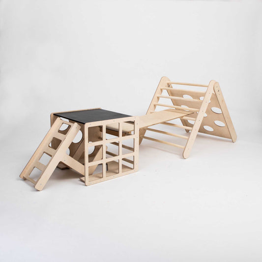 A transformable triangle + climbing cube / table and chair  + a ramp with a ladder and a slide, providing climbing fun for kids.