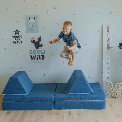 A young boy, Keywords: babies and toddlers, jumping on top of a Sweet HOME from wood activity play couch set.