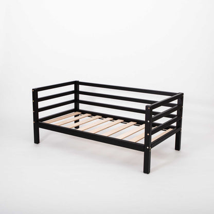A Sweet Home From Wood Kids' bed on legs with a 3-sided horizontal rail and wooden slats on a white background.
