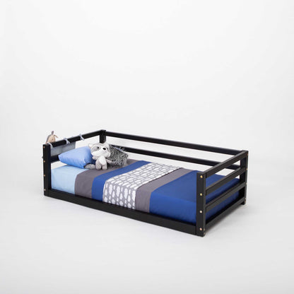 A 2-in-1 transformable kids' bed with a teddy bear on it from Sweet Home From Wood.