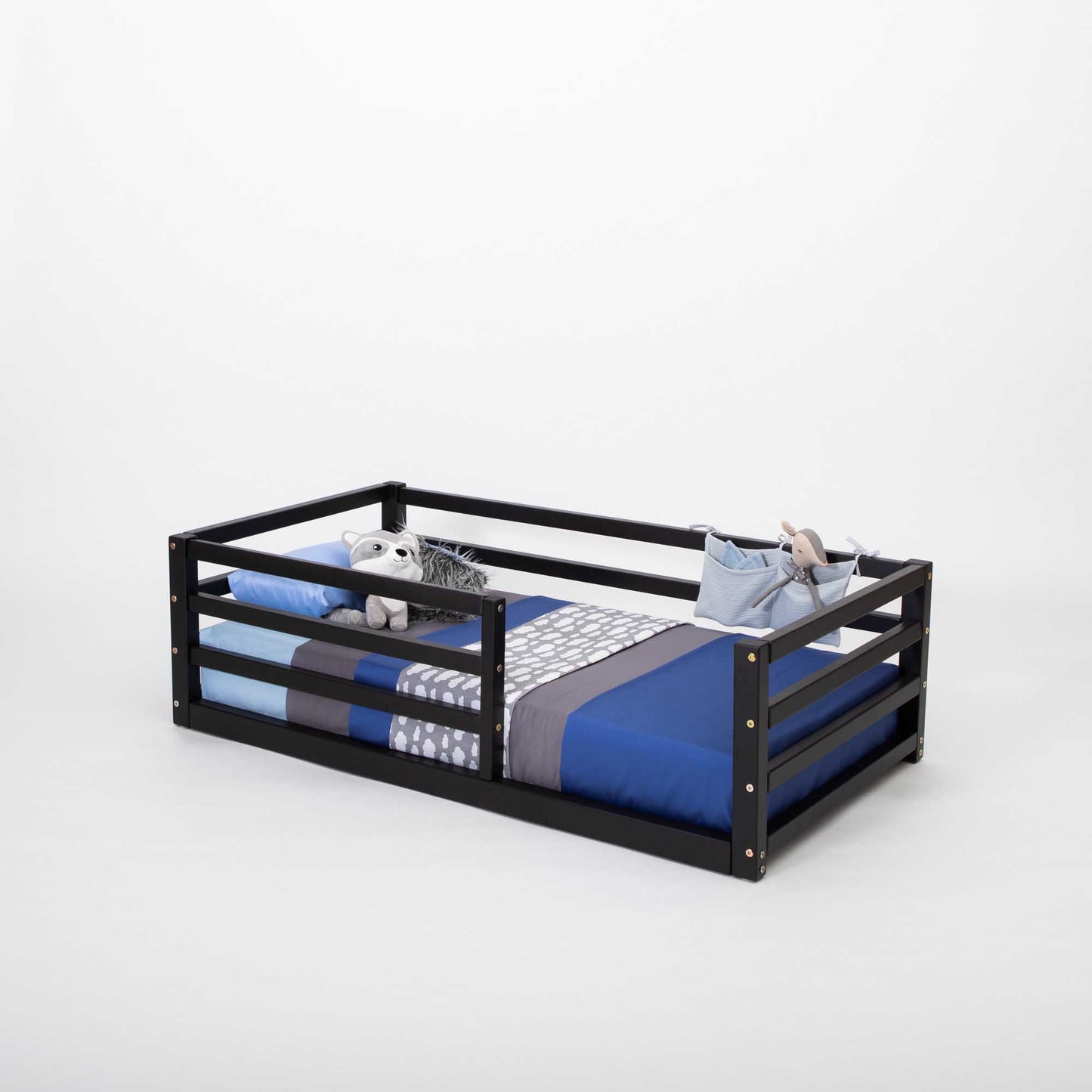 A Sweet Home From Wood 2-in-1 transformable kids' bed with a horizontal rail fence and blue and white bedding.