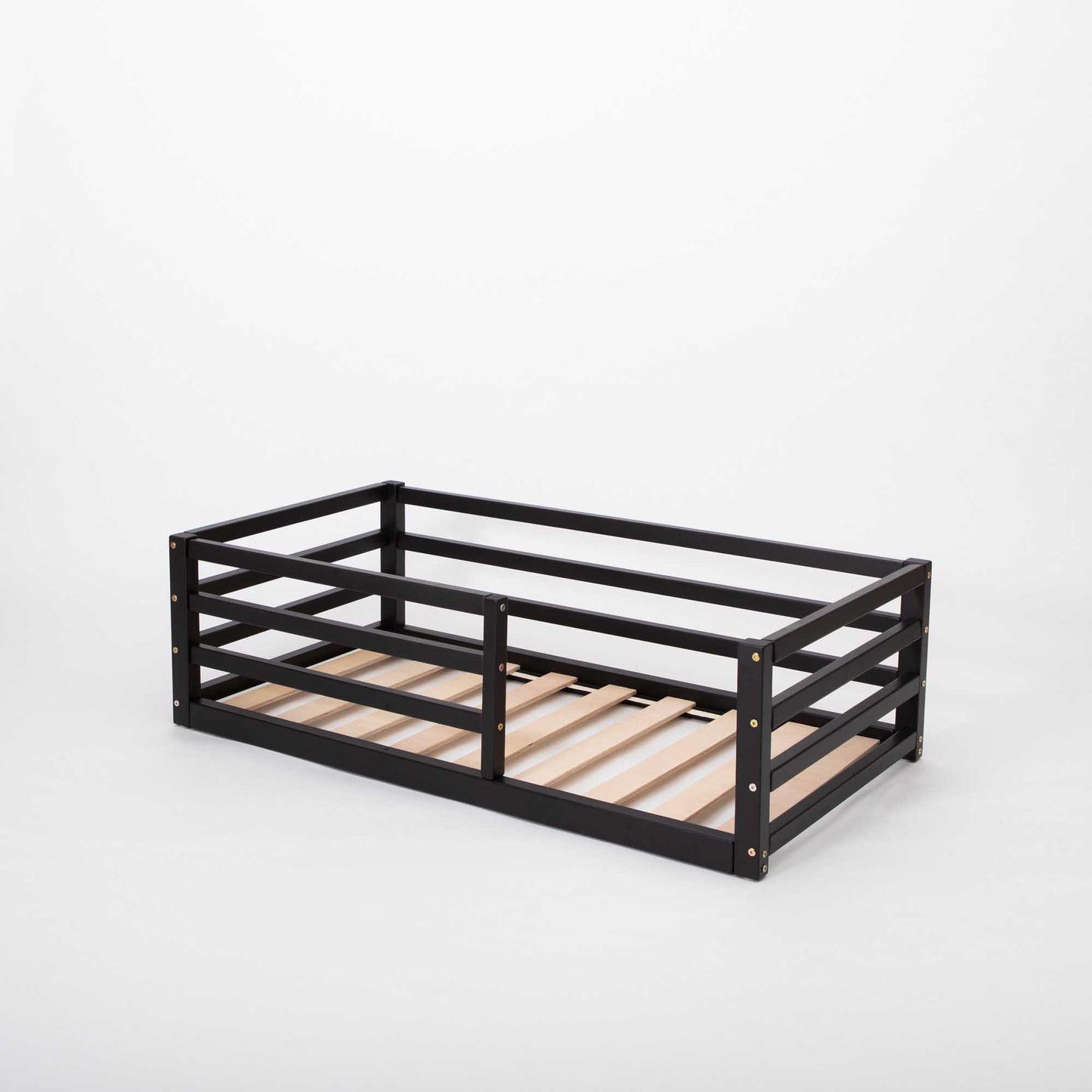 A transitional piece for independent sleeping, this Floor-level kids' bed with a horizontal rail fence from Sweet Home From Wood features wooden slats.